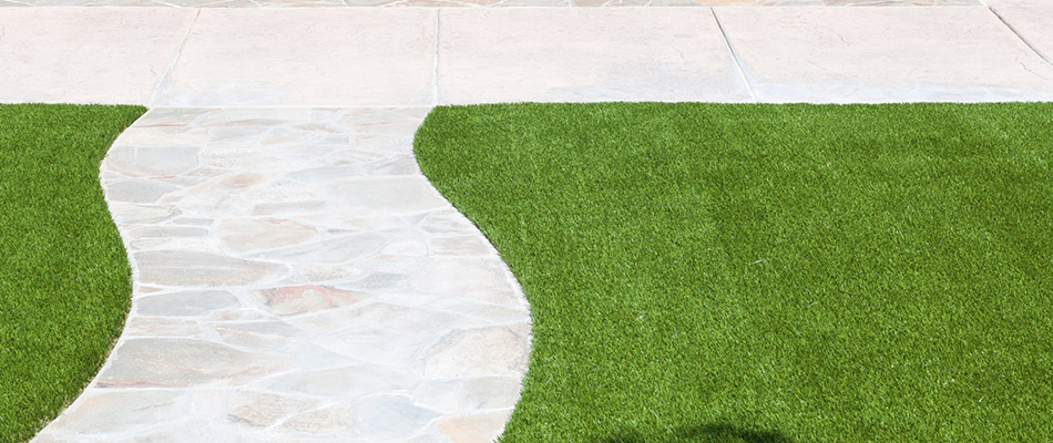 Artificial turf installed along a sidewalk at a home in Oceanside, CA.