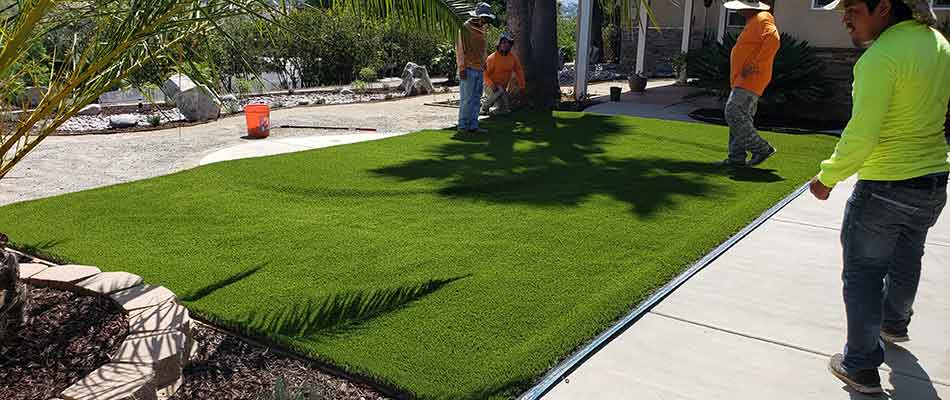 Installing fake grass at a residential property in Encinitas, CA.