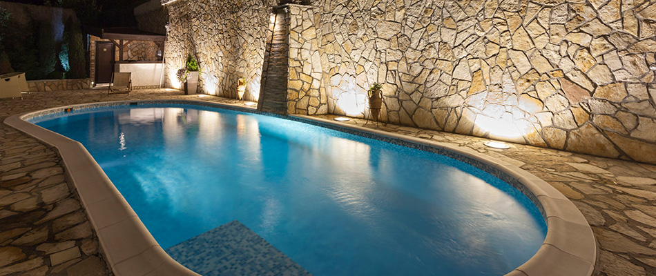 Outdoor pool with lighting features in Carlsbad, CA.