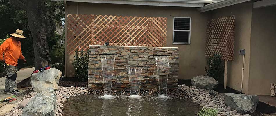 Custom water feature installation at an Escondido, California home property.