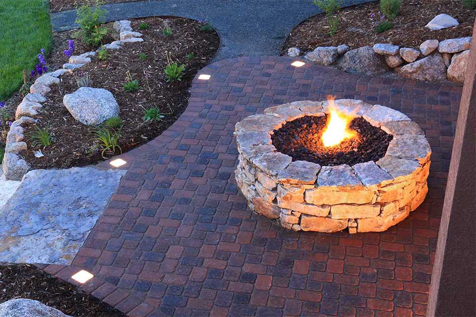 A custom stone fire pit constructed at a Encinitas, CA home.