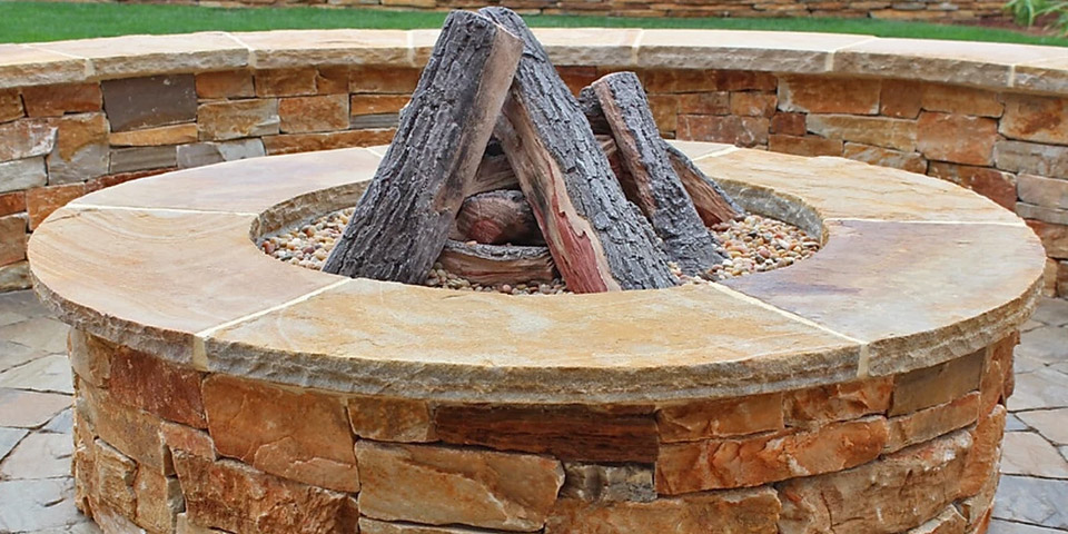 A stone fire pit with seating wall near Rancho Santa Fe, CA.